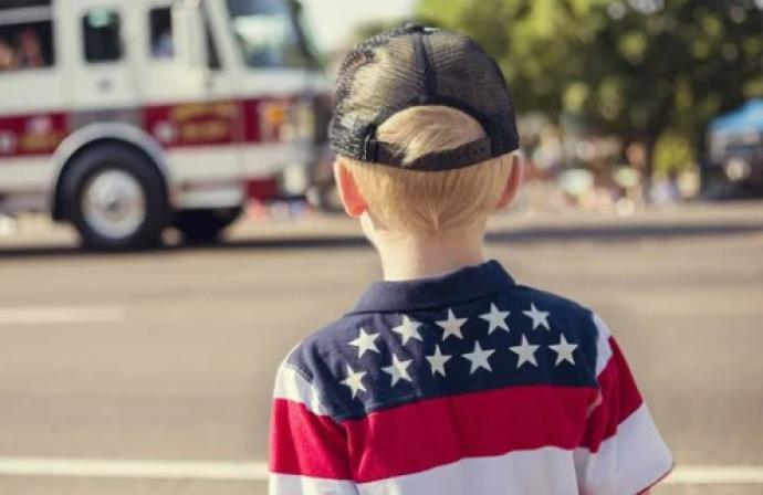 boy at parade with fire truck